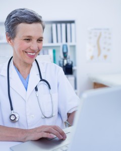 Female doctor using her laptop computer
